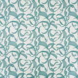 Detail of fabric in an abstract floral print in shades of blue on a cream field.