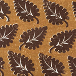 Pattern of brown leaves on a tan background