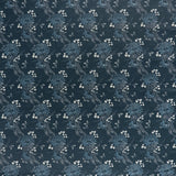 printed linen fabric in a floral and dot pattern in blue and white on a navy field.