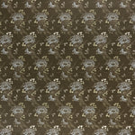 printed linen fabric in a floral and dot pattern in beige and white on a brown field.