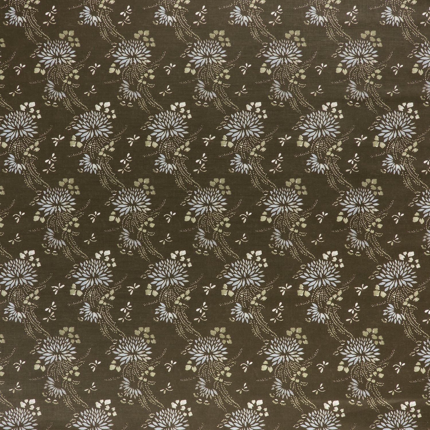 printed linen fabric in a floral and dot pattern in beige and white on a brown field.