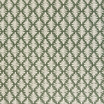 Detail of fabric in a repeating fern leaf print in white on a dark green field.