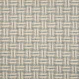 Broadloom carpet with a geometric herringbone design in cream, grey and blue.