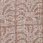 Detail of fabric in an abstract leaf print in tan on a brown field.