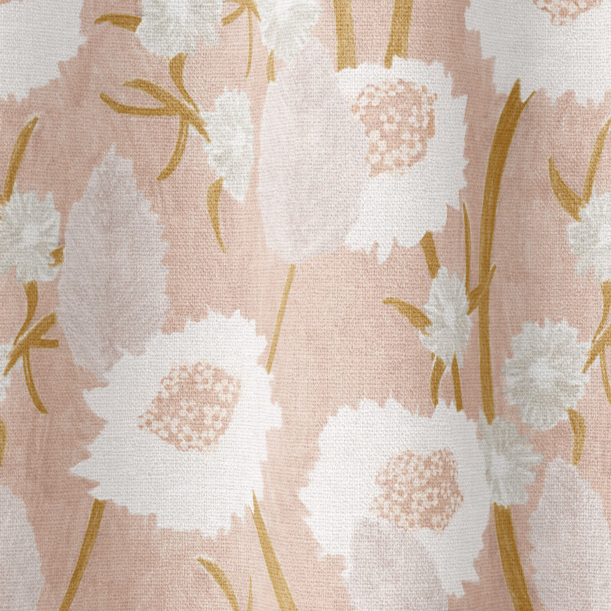 Draped fabric in a playful floral print in shades of pink, white and tan on a light pink field.