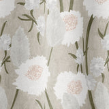 Draped fabric in a playful floral print in shades of white, olive and gray on a cream field.