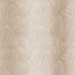 Draped fabric in a textural painted print in tan on a cream field.
