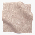 Square fabric swatch in a textural painted print in blush on a cream field.