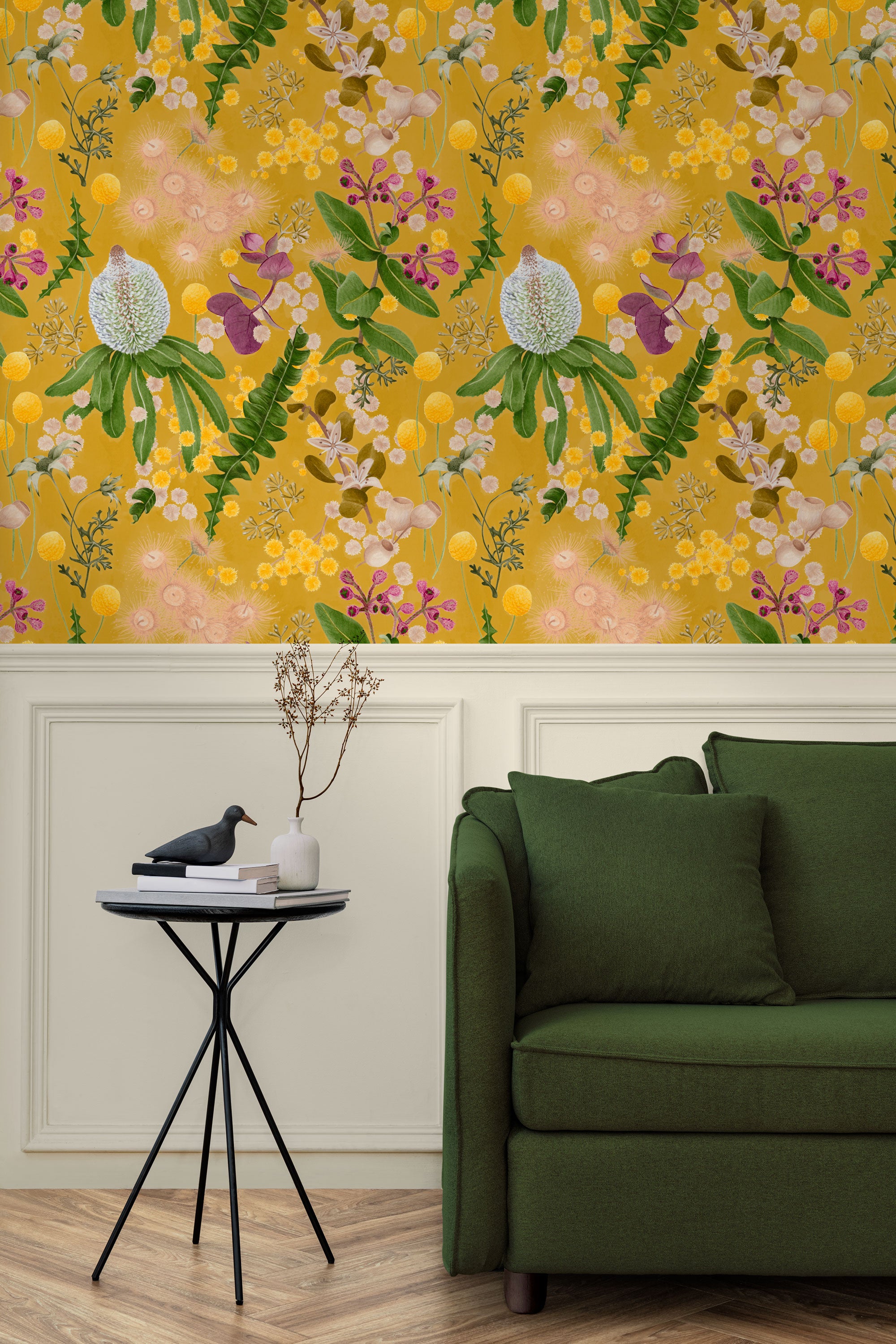 A maximalist living room with a wall papered in a large-scale botanical print in pink, yellow, green and mustard.