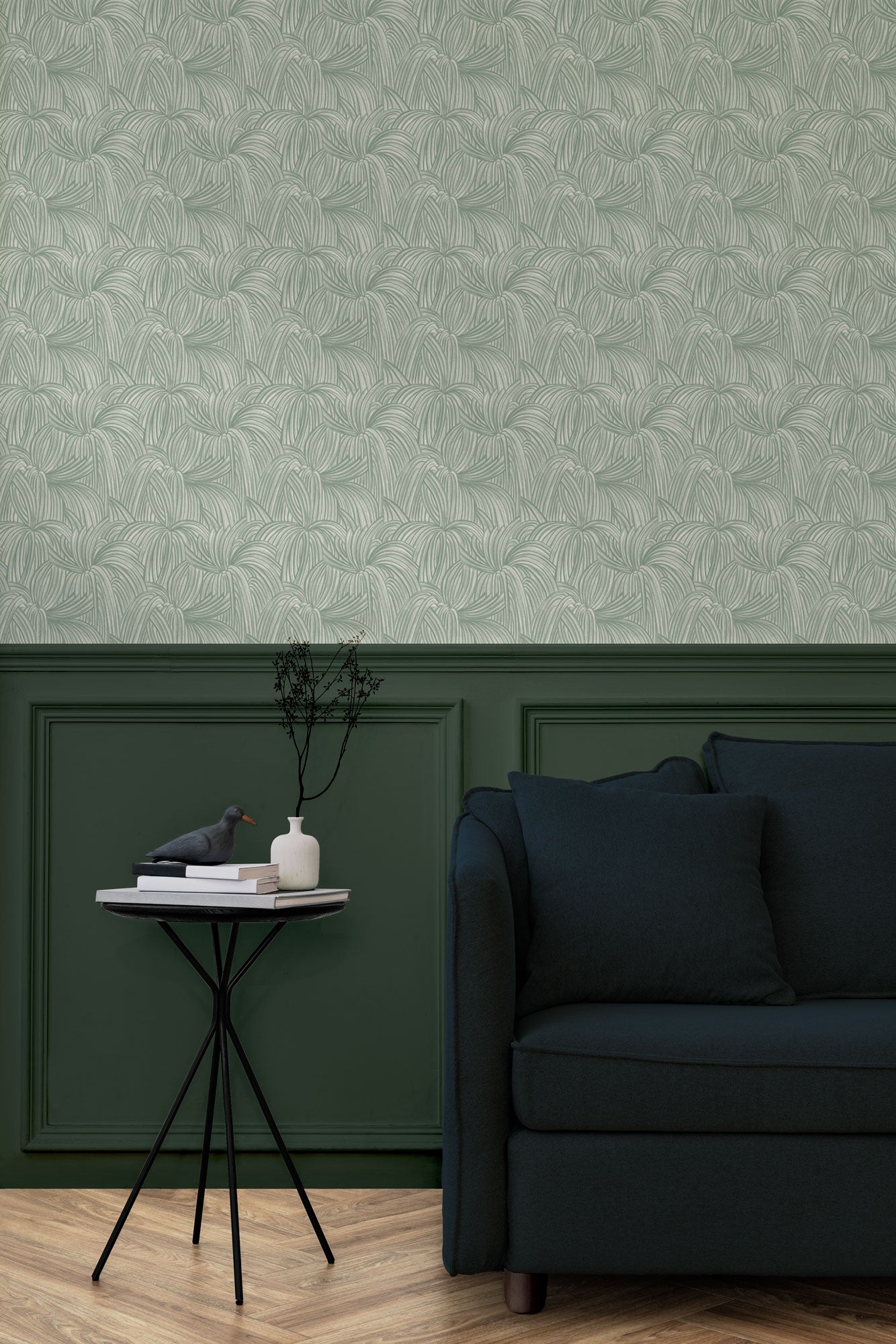 Living room with a wall papered in a textural painted print in sage on a cream field.