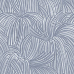 Detail of wallpaper in a textural painted print in blue on a cream field.