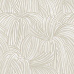 Detail of wallpaper in a textural painted print in tan on a cream field.