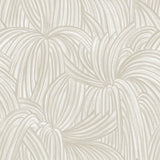 Detail of wallpaper in a textural painted print in tan on a cream field.
