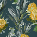 Detail of wallpaper in a photorealistic floral print in shades of yellow, white and green on a navy field.
