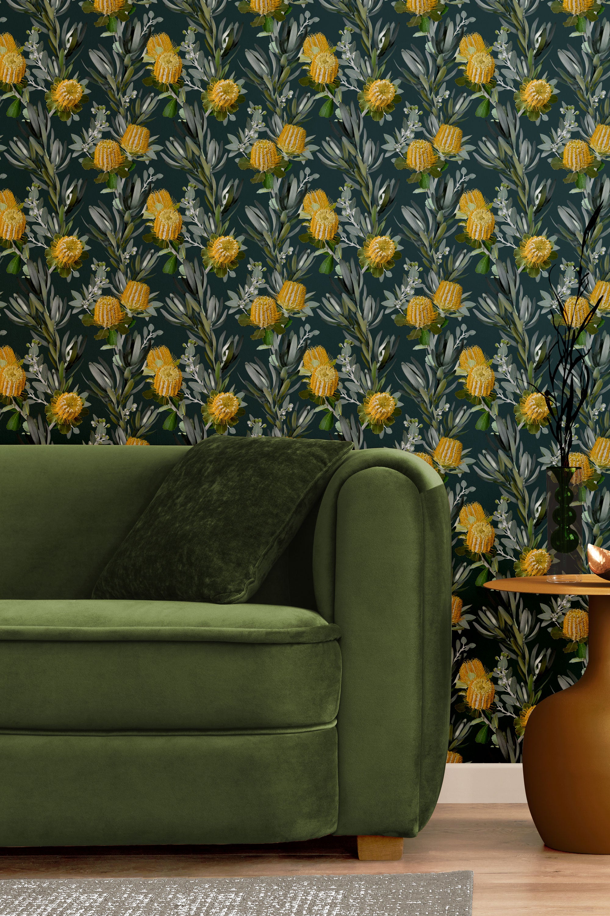 A maximalist living room with a wall papered in a photorealistic floral print in yellow, white, green and navy.
