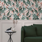 Living room with a wall papered in a large-scale botanical print in blue, turquoise, and pink.