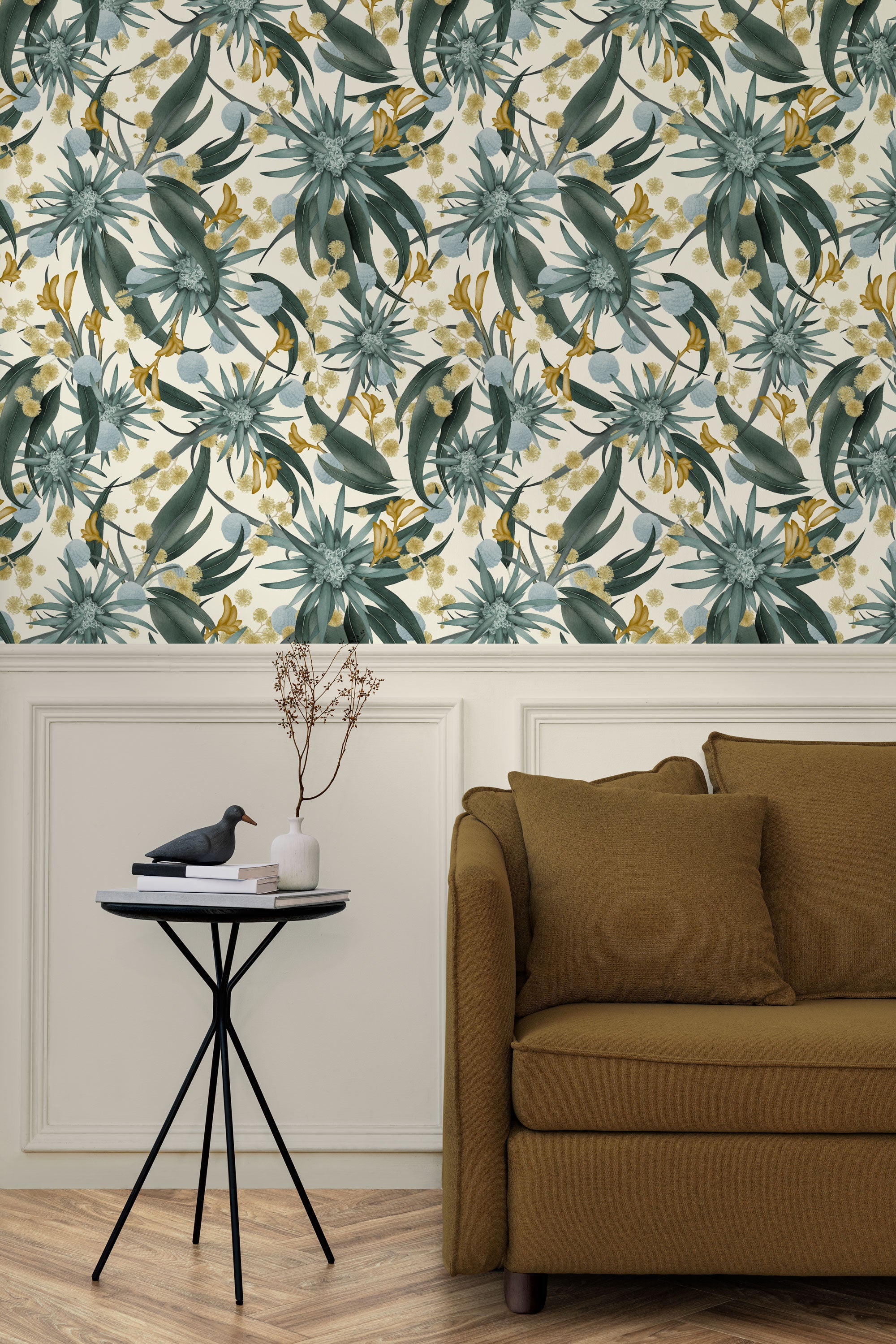 Living room with a wall papered in a large-scale botanical print in blue, turquoise, yellow and cream.