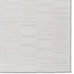 Detail of a hand-painted wallpaper swatch with an undulating ribbon pattern in ivory.