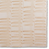 Detail of a hand-painted wallpaper swatch with an undulating ribbon pattern in peach.