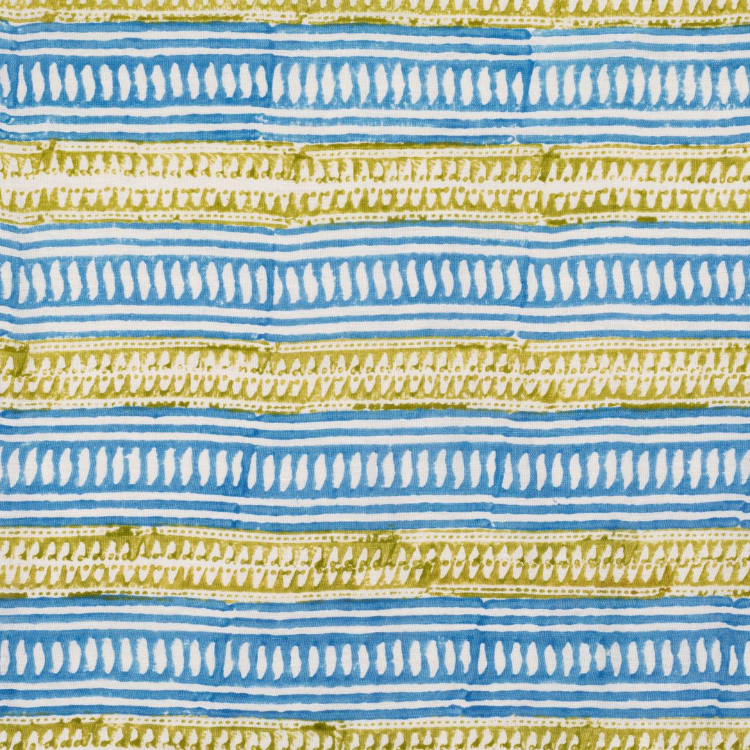 Detail of fabric in a painterly geometric stripe print in blue and mustard on a white field.