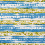 Detail of fabric in a painterly geometric stripe print in blue and mustard on a white field.