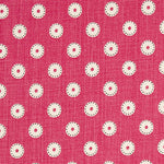 Detail of fabric in a playful dot print in cream and charcoal on a maroon field.