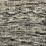 Textured black and white patterned carpet swatch