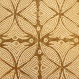 Detail of fabric in a botanical geometric print in shades of tan and brown.