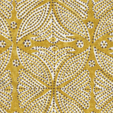 Detail of fabric in a botanical geometric print in shades of mustard and white with a brown dot overlay.