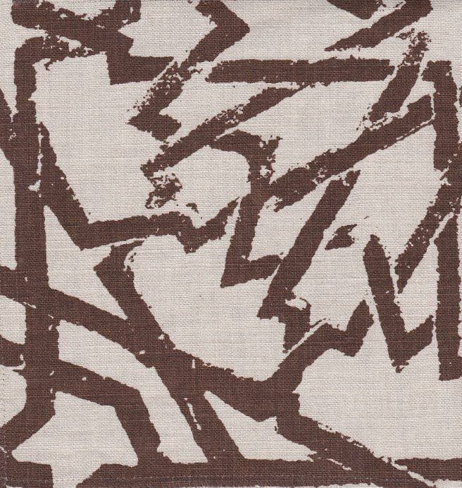 Detail of fabric in a textural lattice print in brown on a cream field.