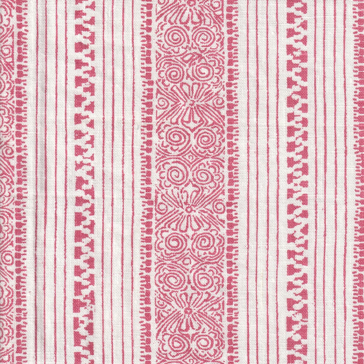 Detail of fabric in a botanical stripe print in pink on a white field.