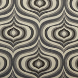 Detail of fabric in a curvilinear geometric print in shades of gray and charcoal on a cream field.