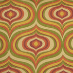 Detail of fabric in a curvilinear geometric print in shades of red and green on a yellow field.