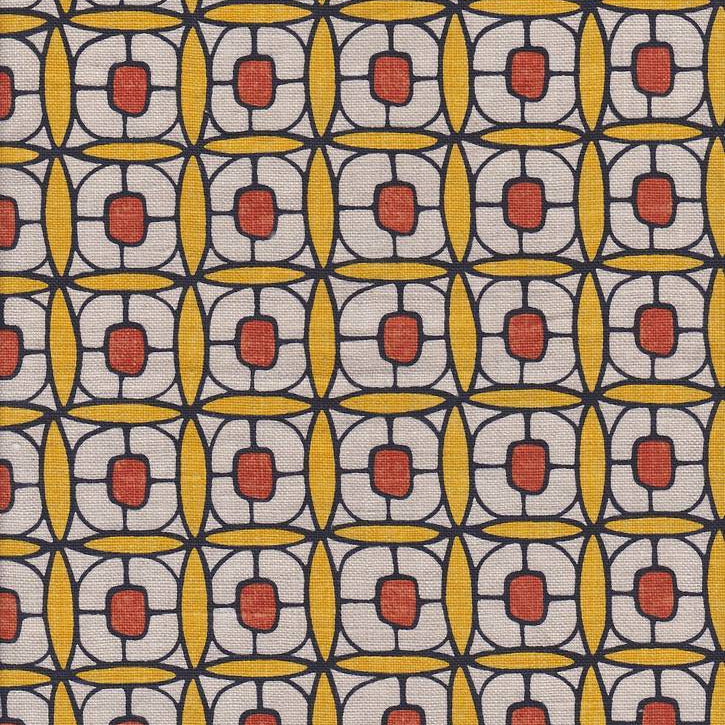 Detail of fabric in a geometric lattice print in red, yellow and brown.