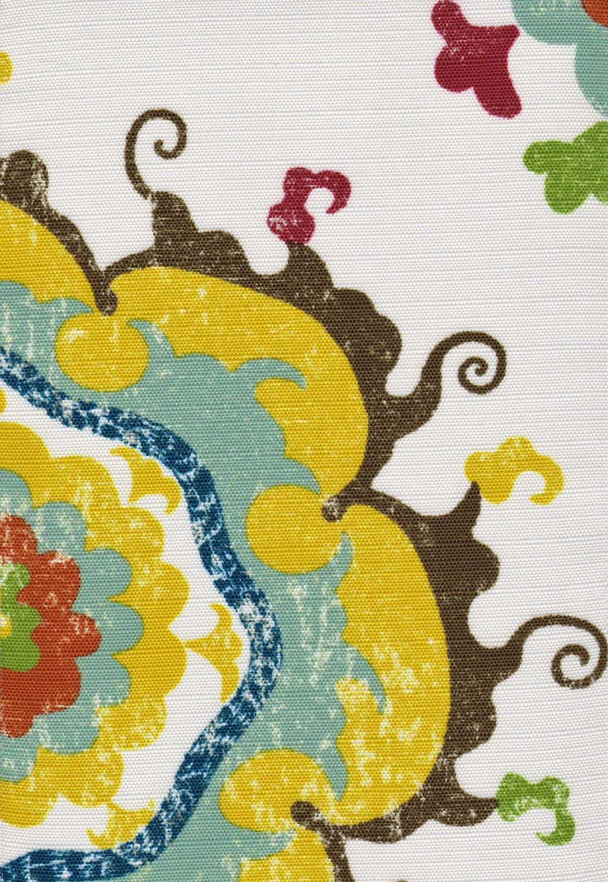 Detail of fabric in a floral paisley print in shades of blue, yellow, red and brown on a white field.