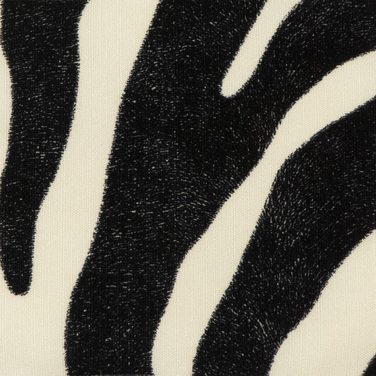 Detail of fabric in a zebra print in black on a white field.