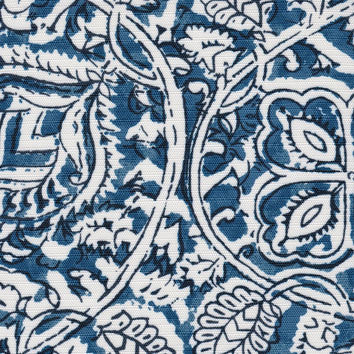 Detail of fabric in a painterly floral paisley in shades of blue and navy on a white field.