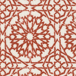 Detail of fabric in a small-scale lattice print in rust on a white field.