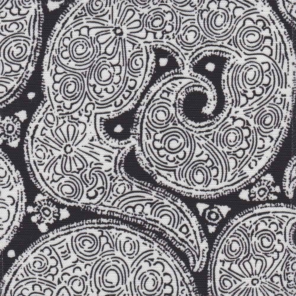 Detail of fabric in a paisley print in white on a black field.