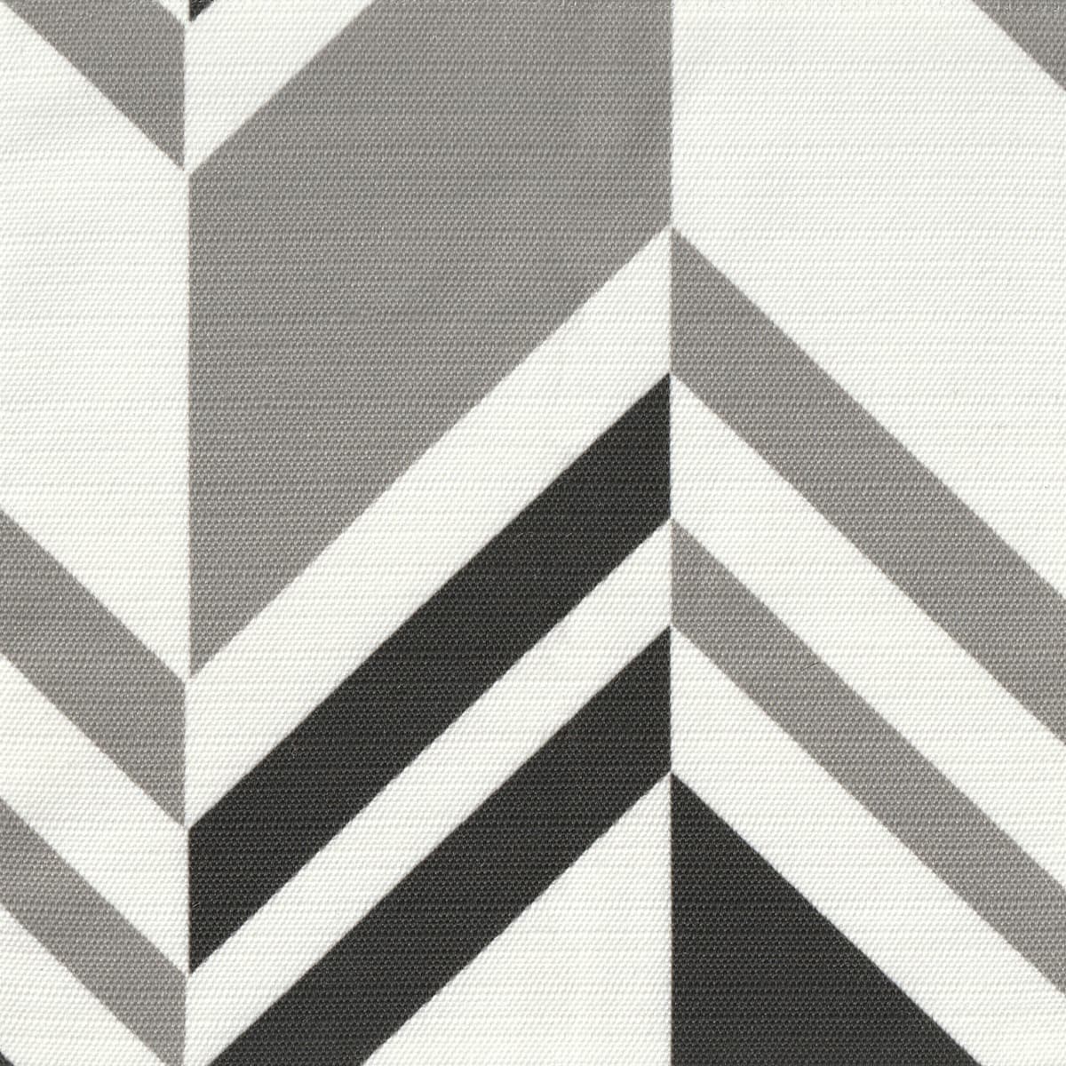 Detail of fabric in an irregular chevron stripe in gray and charcoal on a white field.