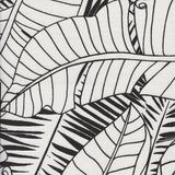 Detail of fabric in a large-scale leaf print in black on a white field.