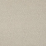 Detail of fabric in a minimalist wood grain print in gray on a cream field.