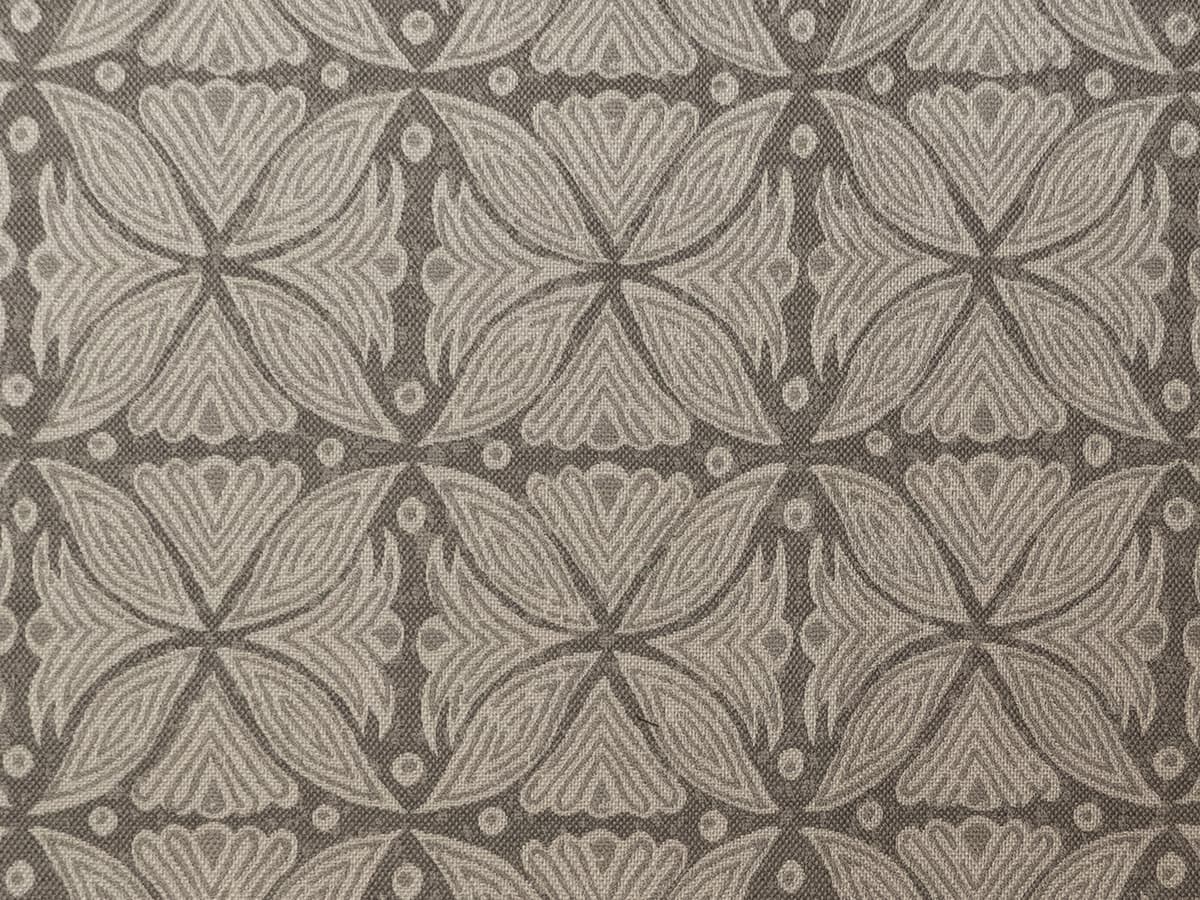 Detail of fabric in a botanical geometric print in shades of gray.