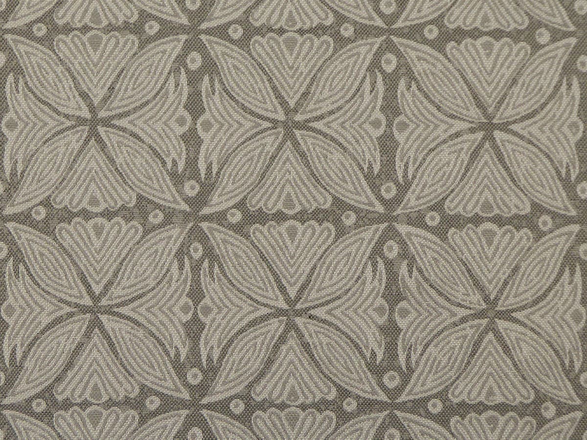 Detail of fabric in a botanical geometric print in shades of gray.