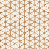 Detail of fabric in a painterly lattice print in brown on a cream field.