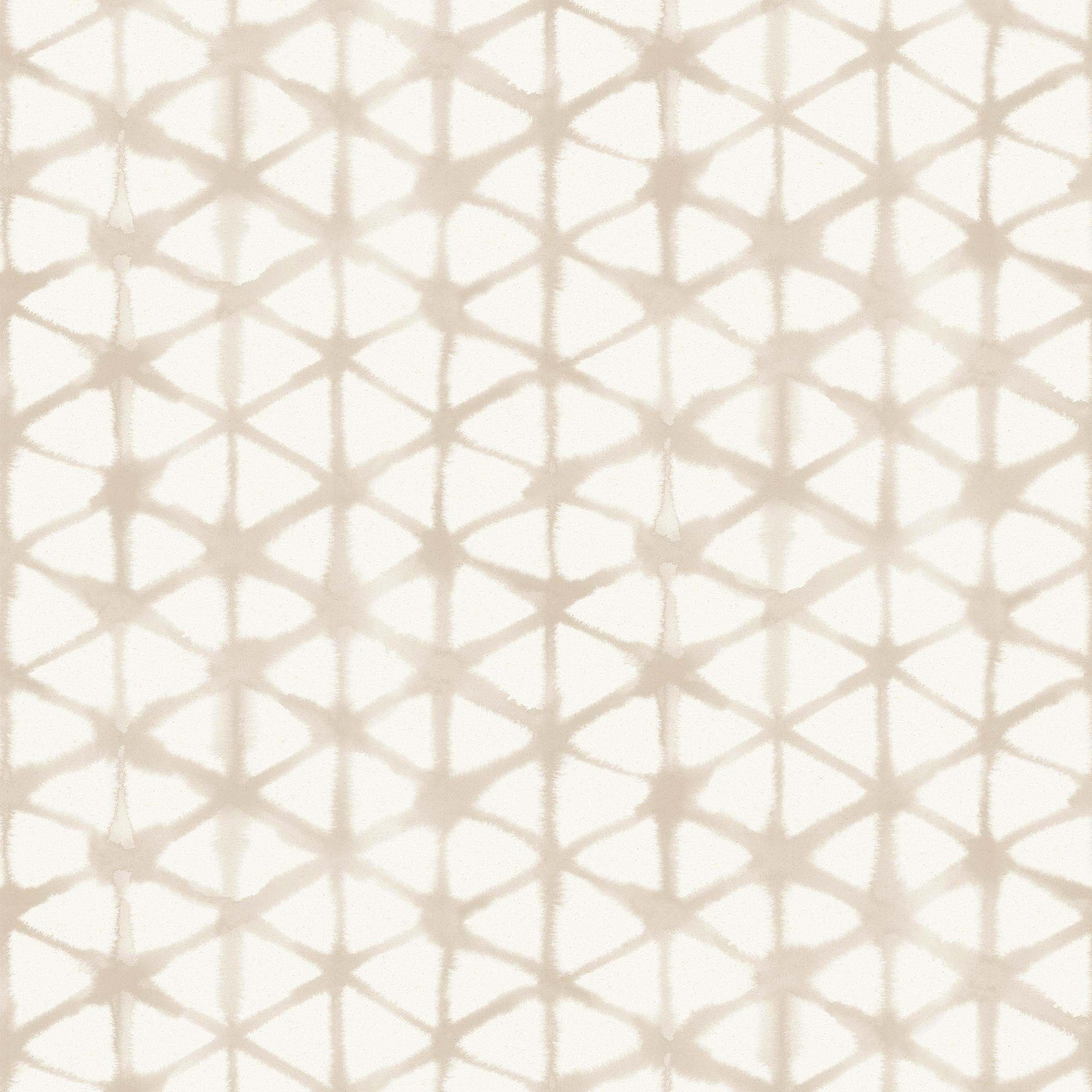 Detail of fabric in a painterly lattice print in tan on a cream field.