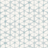 Detail of fabric in a painterly lattice print in light blue on a cream field.