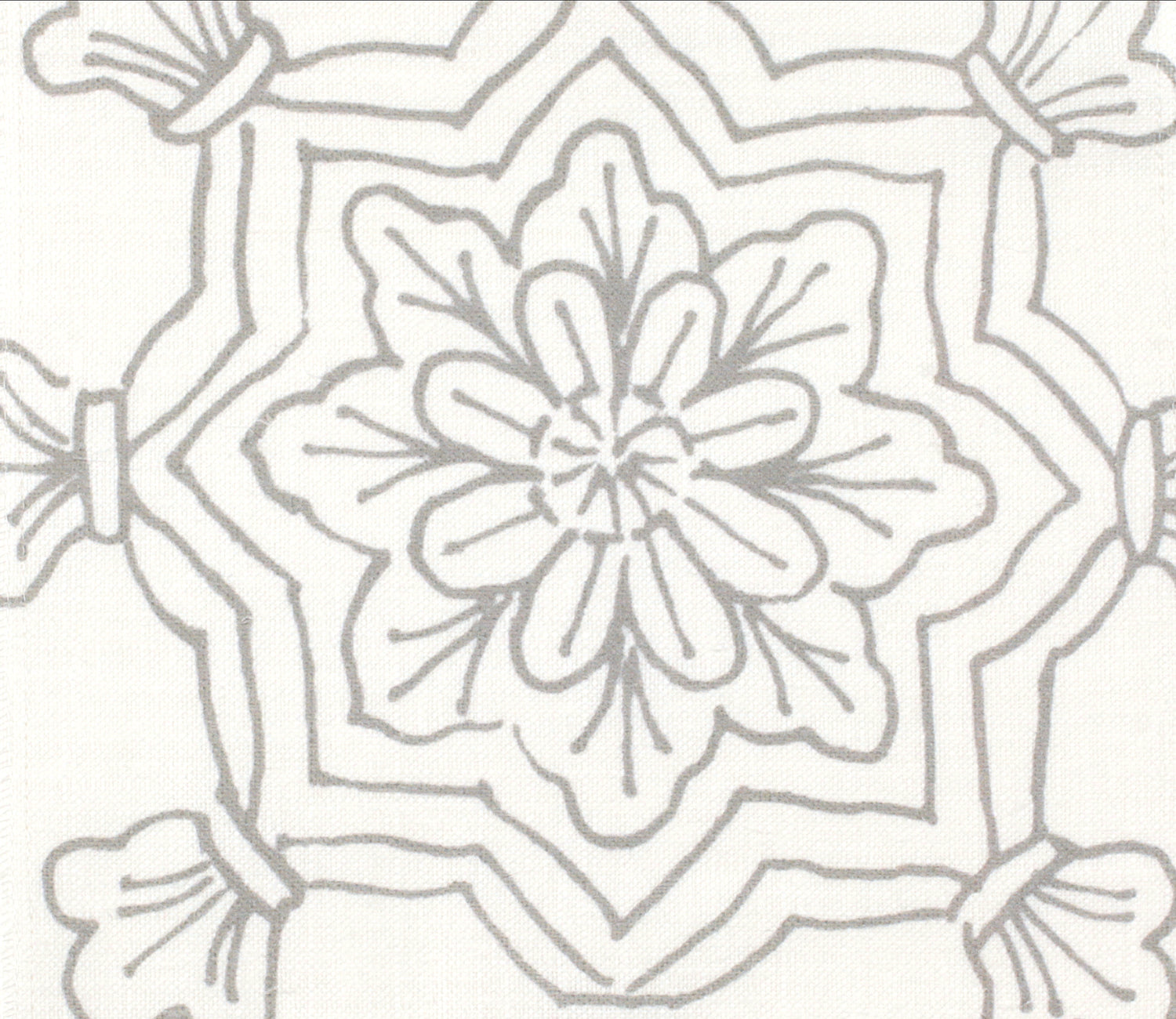 Detail of fabric in a floral medallion print in gray on a white field.