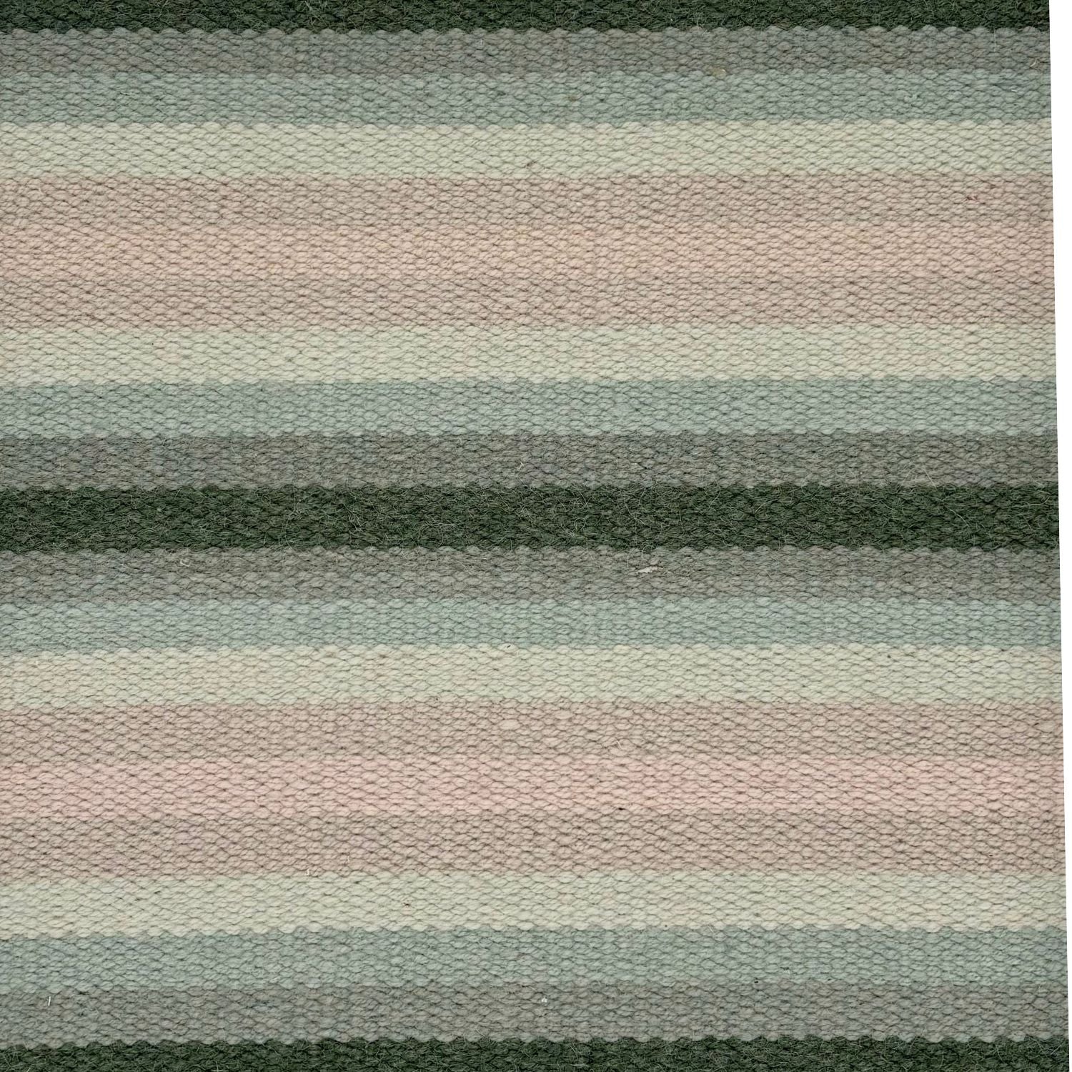 A flatweave rug with stripes in 3 shades of green, 2 shades of pale pink, and ivory.