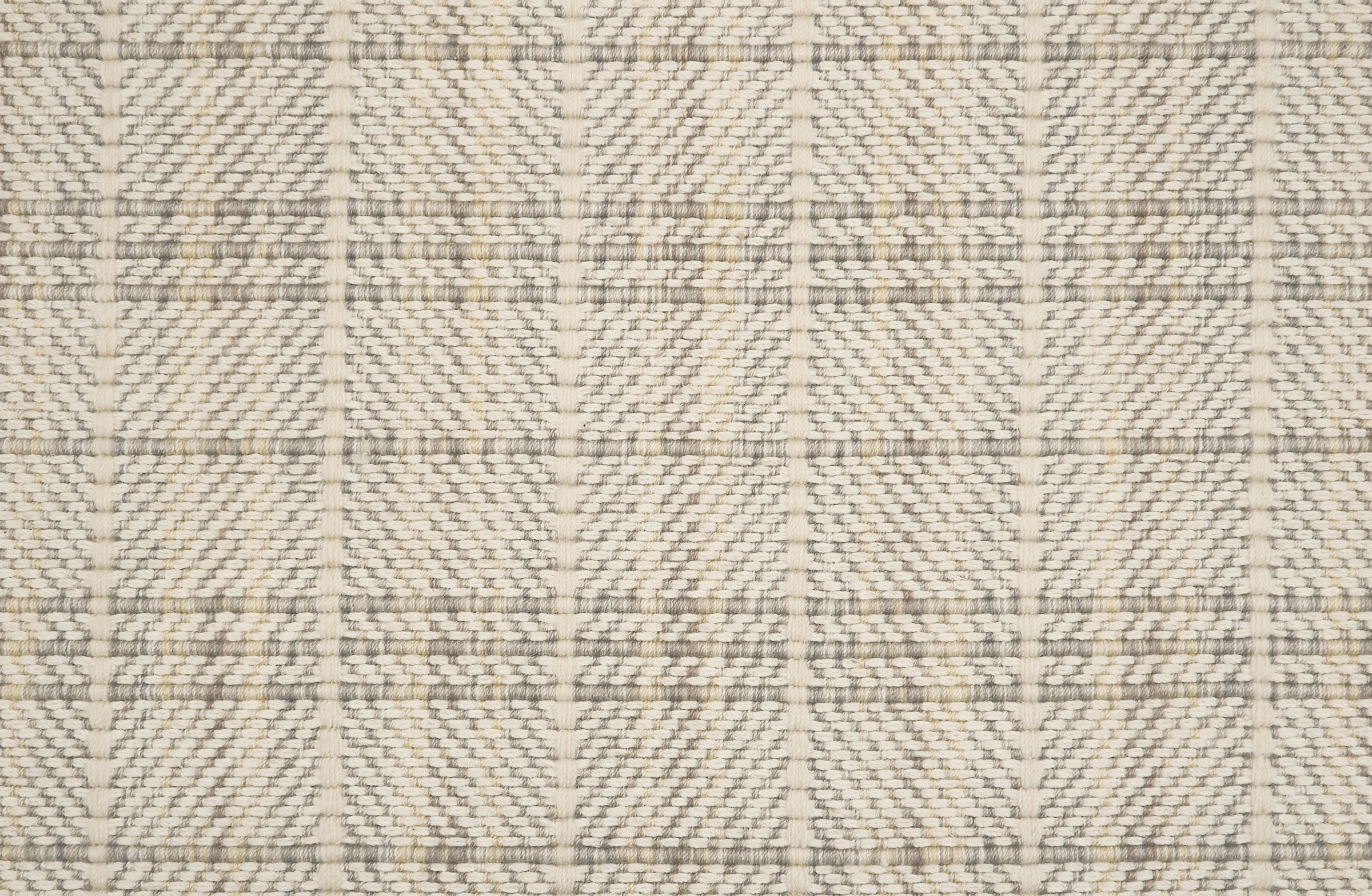 Plaid pattern broadloom with grey and beige on a herringbone patterned background.